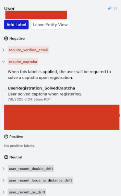 An entity view with negative labels applied, one expanded to show its description and the rule event that produced it, plus neutral labels below; identifying values are redacted